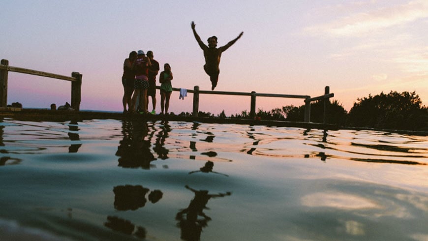 Bye Bye Beta. A man leaping into the water.