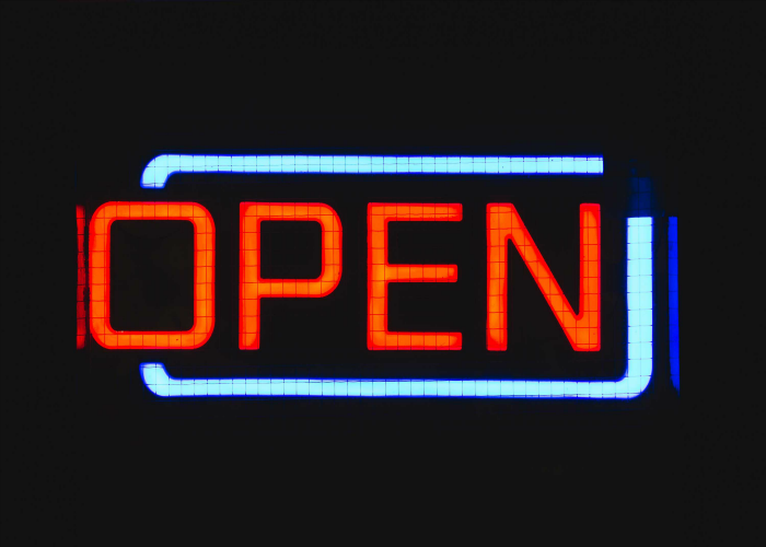 The future of open innovation - a neon open sign.