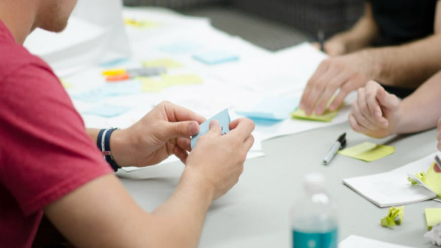 People working with Post-it notes